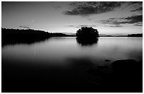 Sunset with moon on island on Kabetogama Lake near Ash river. Voyageurs National Park, Minnesota, USA. (black and white)