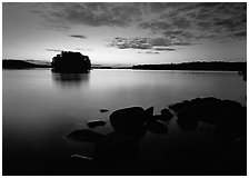 Kabetogama lake sunset with eroded granite and tree-covered islet. Voyageurs National Park ( black and white)