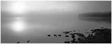 Misty lake scene with sun piercing fog, Kabetogama Lake. Voyageurs National Park (Panoramic black and white)