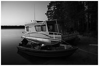 Motorboat and houseboat at dusk, Houseboat Island. Voyageurs National Park ( black and white)