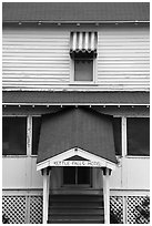 Kettle Falls Hotel door and window with red and white stripes awning. Voyageurs National Park ( black and white)