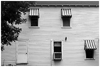 Kettle Falls Hotel wall with with red and white stripes awnings. Voyageurs National Park ( black and white)