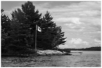 Islet with Canadian flag, Namakan Lake. Voyageurs National Park ( black and white)
