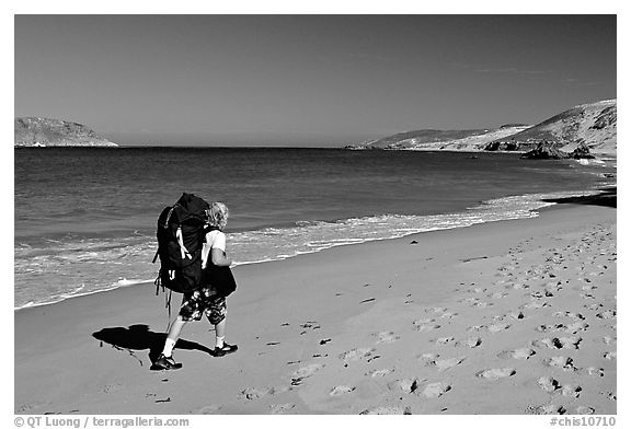 Backpacker on beach, Cuyler harbor, San Miguel Island. Channel Islands National Park (black and white)