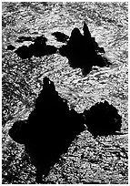 Backlit rocks and water, Cathedral Cove, Anacapa, late afternoon. Channel Islands National Park, California, USA. (black and white)