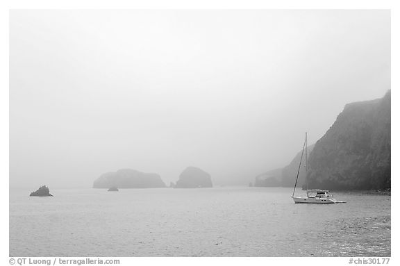 Yacht moored in Scorpion Anchorage in  fog, Santa Cruz Island. Channel Islands National Park (black and white)