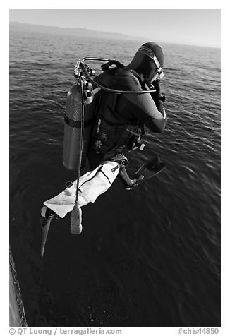 Scuba diver jumping from boat. Channel Islands National Park (black and white)