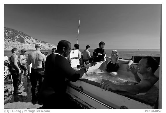 Divers in hot tub aboard the Spectre dive boat, Santa Cruz Island. Channel Islands National Park (black and white)