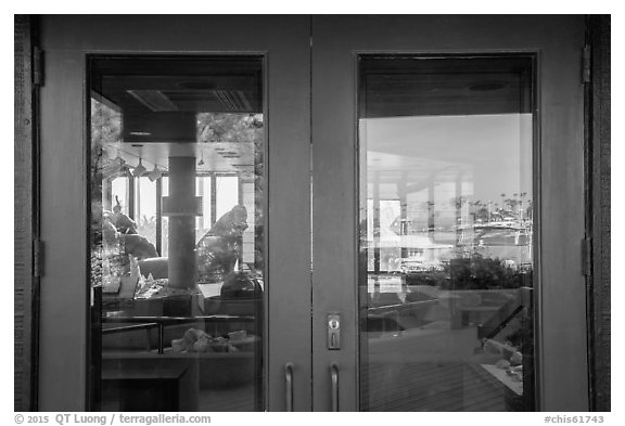 Ventura Harbor visitor center window reflexion. Channel Islands National Park (black and white)