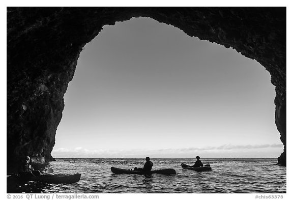 Looking out sea cave with group of kayakers, Santa Cruz Island. Channel Islands National Park (black and white)
