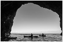 Looking out sea cave with group of kayakers, Santa Cruz Island. Channel Islands National Park ( black and white)