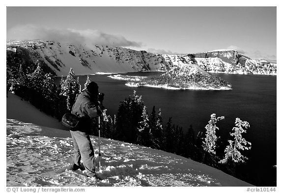 Photographer on  rim of  Lake in winter. Crater Lake National Park (black and white)