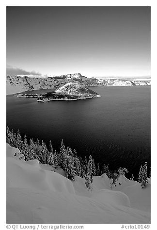 Wizard Island and lake in winter, late afternoon. Crater Lake National Park, Oregon, USA.