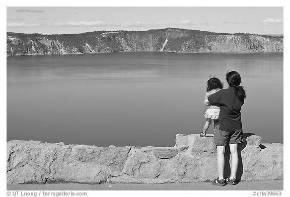 Woman and baby looking at Crater Lake. Crater Lake National Park (black and white)