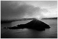 Sun rising behind Wizard Island. Crater Lake National Park ( black and white)