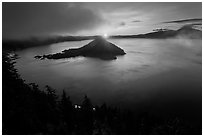 Wide view with sunrise and clouds. Crater Lake National Park, Oregon, USA. (black and white)