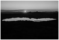 Wide view from Mount Scott of sun setting over Crater Lake. Crater Lake National Park ( black and white)