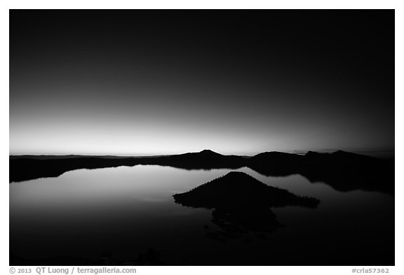 Wide view of lake with dawn on eastern horizon. Crater Lake National Park (black and white)