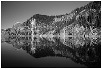 Cliffs reflected in calm waters. Crater Lake National Park ( black and white)