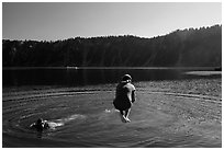 Girl jumps in water in Governors Bay, Wizard Island. Crater Lake National Park ( black and white)