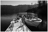Visitors embark on tour boat at Wizard Island boat dock. Crater Lake National Park ( black and white)