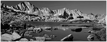 High Sierra peaks reflected in blue alpine lake. Kings Canyon National Park (Panoramic black and white)