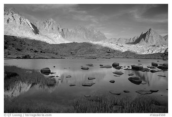 Mt Agasiz, Mt Thunderbolt, and Isoceles Peak reflected in a lake in Dusy Basin, late afternoon. Kings Canyon National Park (black and white)