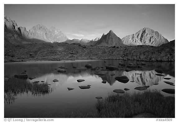Mt Thunderbolt, Isoceles Peak, and Palissades reflected in a lake in Dusy Basin, sunset. Kings Canyon National Park (black and white)