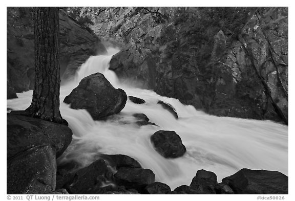 Forceful waterfall rushing through narrow granite chute. Kings Canyon National Park (black and white)