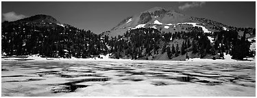 Melting ice in lake and Lassen Peak. Lassen Volcanic National Park (Panoramic black and white)