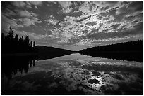 Moonlit clouds over Juniper Lake at night. Lassen Volcanic National Park ( black and white)