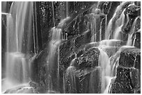 Waterfall over columns of cooled lava. Mount Rainier National Park, Washington, USA. (black and white)