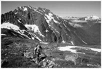 Mountaineer hiking on the way to Sahale Peak,  North Cascades National Park. Washington, USA. (black and white)