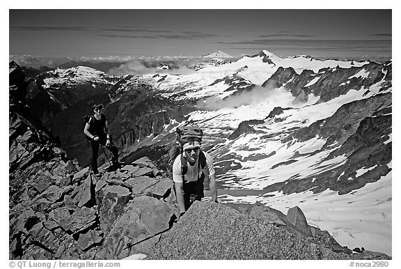 Mountaineers on ridge below  summit of Sahale Peak, North Cascades National Park. Washington, USA.