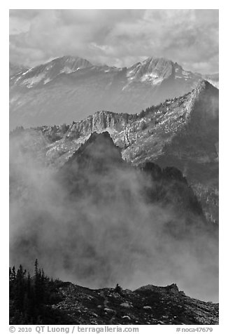 Peaks partly obscured by clouds, North Cascades National Park.  (black and white)