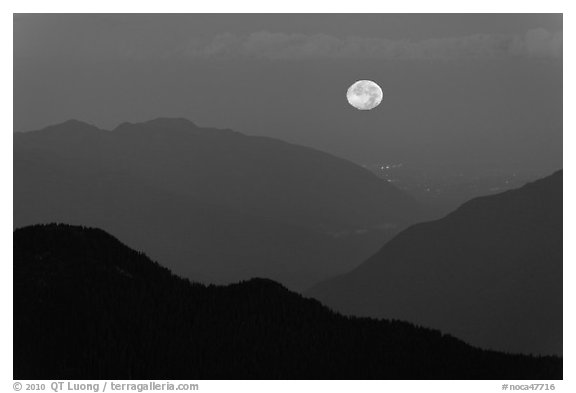 Moon setting over ridges, North Cascades National Park.  (black and white)