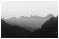 First sunrays lighting peaks above Cascade Pass, North Cascades National Park.  ( black and white)