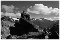 Man sitting on rock photographs mountain panorama, North Cascades National Park.  ( black and white)
