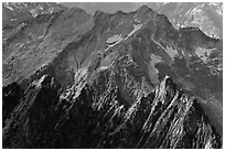 Steep forested spires in dabbled light, North Cascades National Park.  ( black and white)