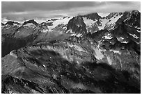 Cloud-capped mountains in dabbled light, North Cascades National Park.  ( black and white)