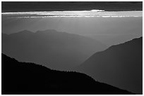 Layered ridges with sun behind clouds, North Cascades National Park.  ( black and white)