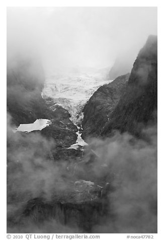 Hanging glacier in fog, North Cascades National Park.  (black and white)