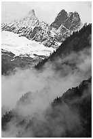 Inspiration Peak and the Pyramid rising above clouds, North Cascades National Park.  ( black and white)