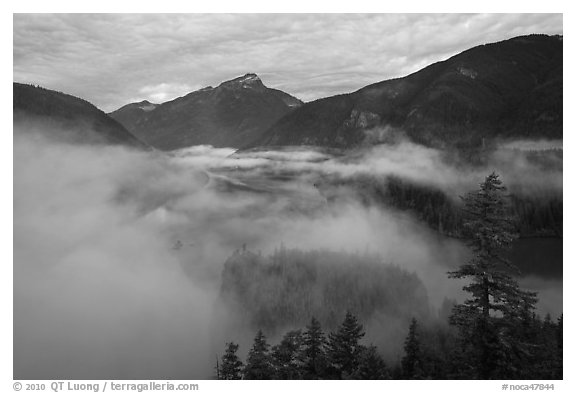 Low fog rolling over Diablo Lake, dawn, North Cascades National Park Service Complex.  (black and white)