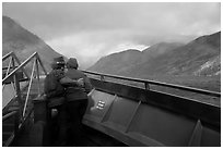 Couple at bow of boat looking at rainbow over Lake Chelan, North Cascades National Park Service Complex.  ( black and white)