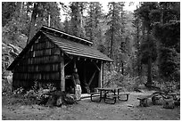 Hiker at high Bridge campground shelter, North Cascades National Park.  ( black and white)