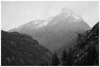 Snow-capped jagged peak in clouds, North Cascades National Park.  ( black and white)