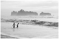 Children playing in water in front of sea stacks, Rialto Beach. Olympic National Park ( black and white)