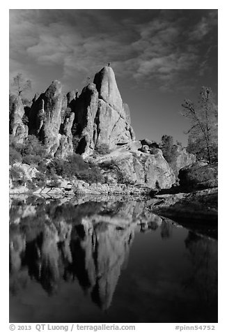 Climber standing on spire next to Bear Gulch Reservoir. Pinnacles National Park (black and white)