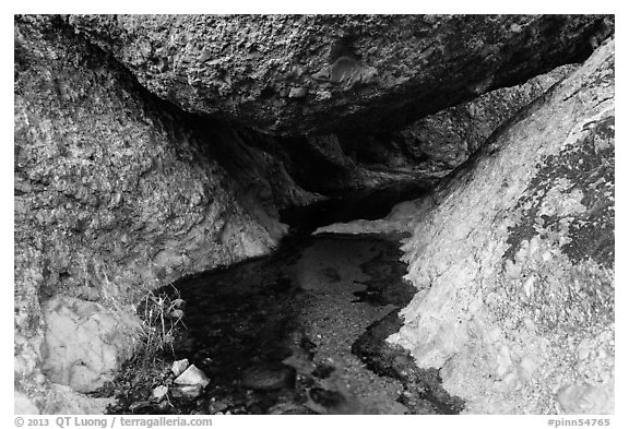 Creek flowing under boulder. Pinnacles National Park (black and white)